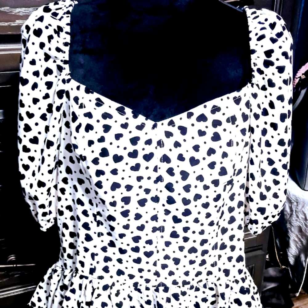 Super cute White/Black heart Top with  sweetheart neckline and ruffled bottom.